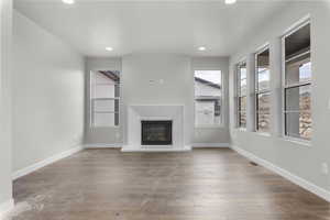 Unfurnished living room featuring light wood-type flooring