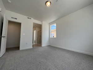 Unfurnished bedroom featuring carpet