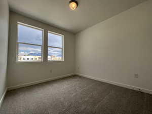 Unfurnished room with carpet