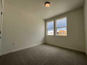 Unfurnished room with carpet