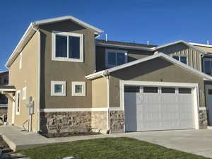 View of front of property featuring a garage