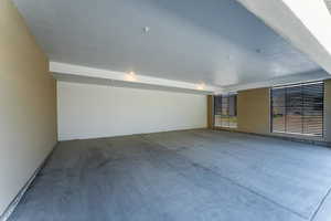 Spare room featuring concrete flooring