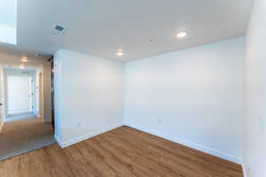 Unfurnished room featuring hardwood / wood-style floors