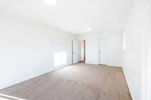 Unfurnished bedroom with carpet floors