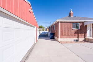 View of property exterior with a garage