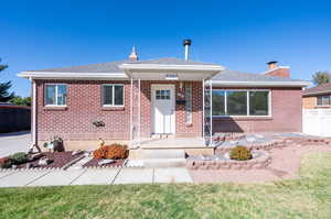 View of front of property with a front lawn