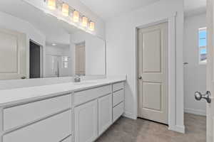 Bathroom with vanity and an enclosed shower