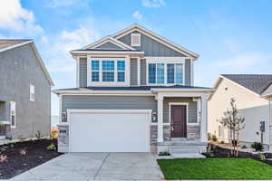 View of front of home featuring a garage