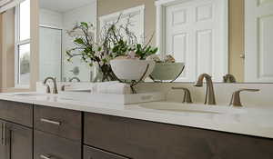 Primary bath featuring double sinks and walk in shower.  (this image may differ from actual home/features)