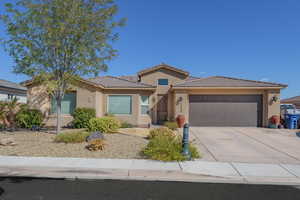 View of front of home featuring a garage