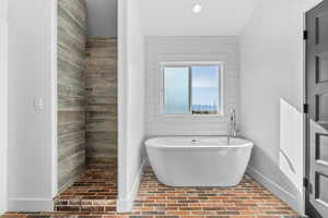 Bathroom featuring separate shower and tub