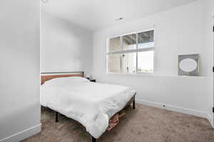 View of carpeted bedroom