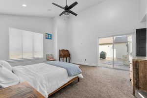 Bedroom with multiple windows, carpet floors, ceiling fan, and access to exterior