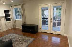 Entryway with french doors and dark hardwood / wood-style flooring