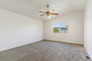 Carpeted Bedroom with ceiling fan and lofted ceiling