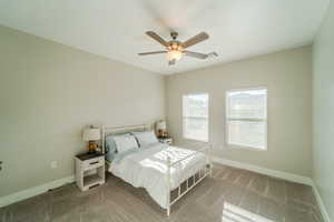 Bedroom featuring light carpet and ceiling fan