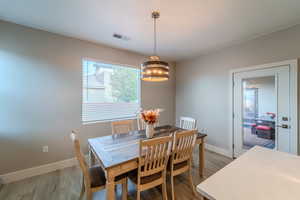 Dining space featuring wood-type flooring