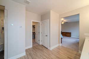 Hall featuring light wood-type flooring