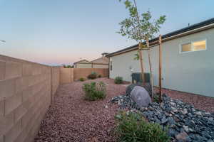 Yard at dusk with central AC