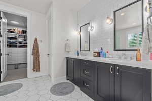 Bathroom with vanity and tile patterned floors