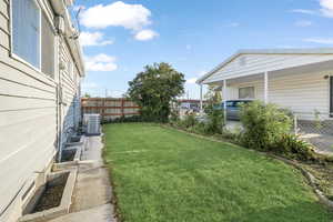 View of yard with central AC