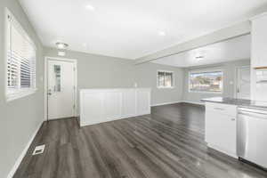 Unfurnished living room with dark hardwood / wood-style flooring