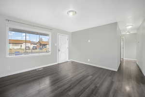 Foyer with dark hardwood / wood-style flooring