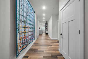 Hallway featuring wood-type flooring