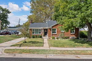 View of front of property with a front yard