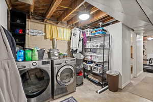 Washroom featuring separate washer and dryer