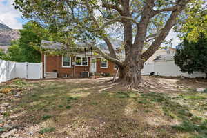 Rear view of property featuring central air condition unit