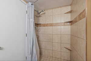 Bathroom with a shower with curtain