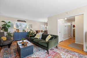 Living room featuring a chandelier and hardwood / wood-style flooring