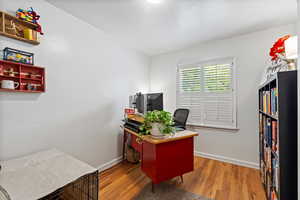 Office space featuring hardwood / wood-style floors