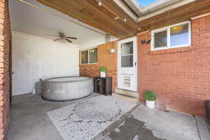 View of patio featuring ceiling fan