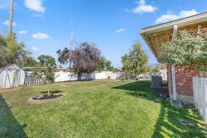 View of yard featuring a storage shed