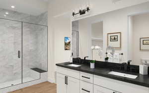 Bathroom featuring vanity, hardwood / wood-style floors, and an enclosed shower