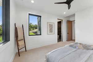 Bedroom featuring ceiling fan and light carpet