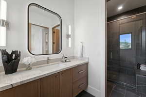 Bathroom with vanity and walk in shower