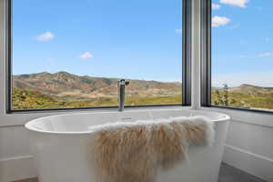 Interior details featuring a mountain view and a tub to relax in