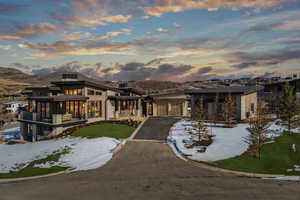 View of front facade featuring a mountain view and a yard