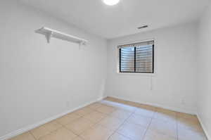 View of tiled basement bedroom