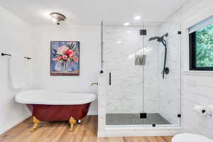 Primary Bathroom with separate tub and shower.