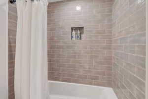 Bathroom featuring shower / tub combo