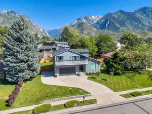 Front of home featuring mountain views and RV parking.