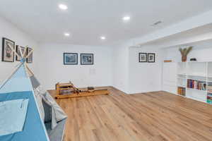 Family recreation room with light LVP flooring