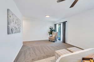 Large primary bedroom suite with private deck, spacious bathroom, and walk in closet.