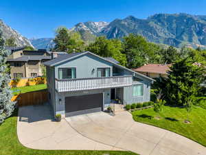 Front of home featuring mountain views and RV parking.