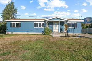 View of front of house with a front lawn