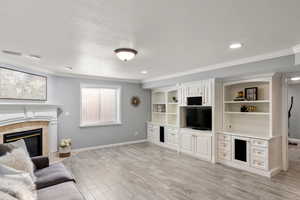 Recreation room with built-in cabinets and audio surround sound